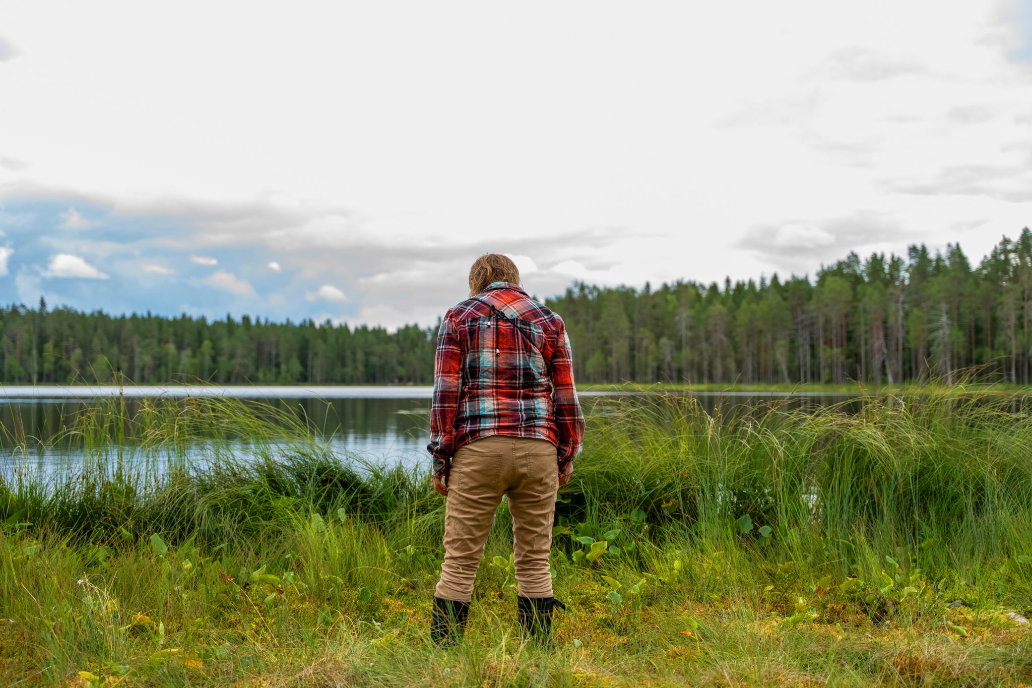 Man standing in front of a swamp