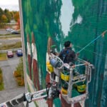 Eloise Gillow created the first Oulu2026 mural in Rajakylä in 2022. Photo: Mika Friman.