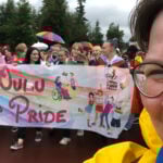 In the photo, Oulu Pride producer Martu Väisänen appears in a selfie together with colorful Oulu Pride participants. Photo: Martu Väisänen.