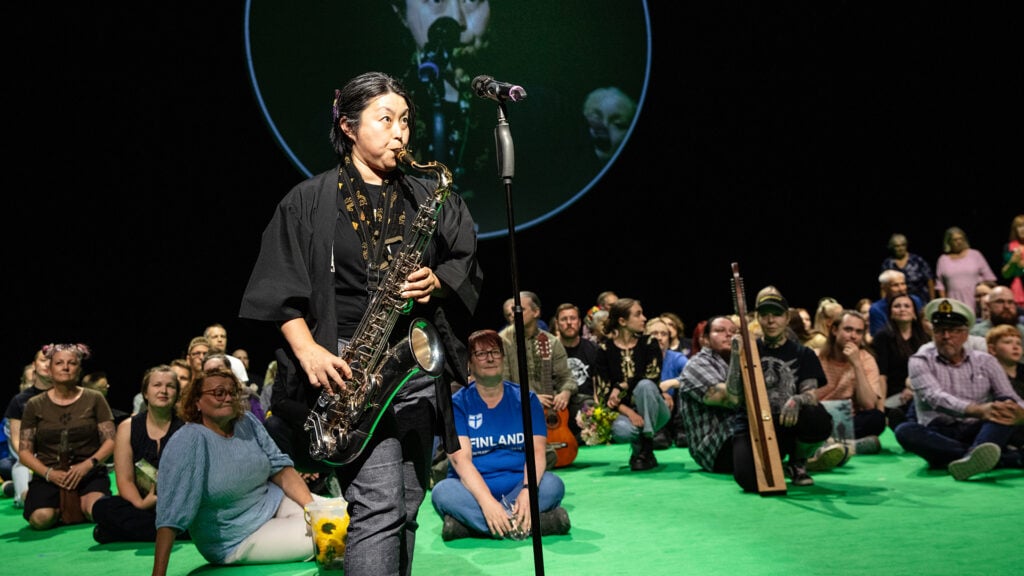 Each participant brings an item that identifies them on stage. Sachi Sekiguchi-Mäki from Japan brings her saxophone. Photo: Kati Leinonen.